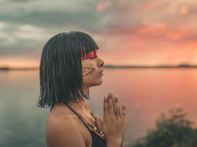 Calm face of a woman meditating.